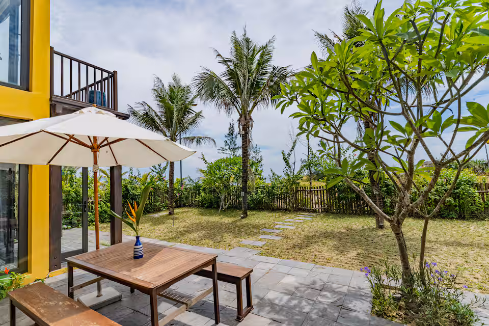 May Villa An Bang Beach Garden Lawn Leading to Private Beachfront Access Hoi An Vietnam