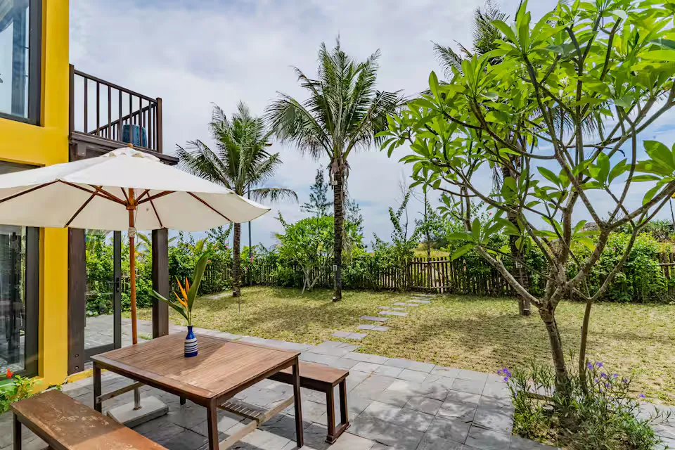 May Villa An Bang Beach Garden Lawn Leading to Private Beachfront Access Hoi An Vietnam